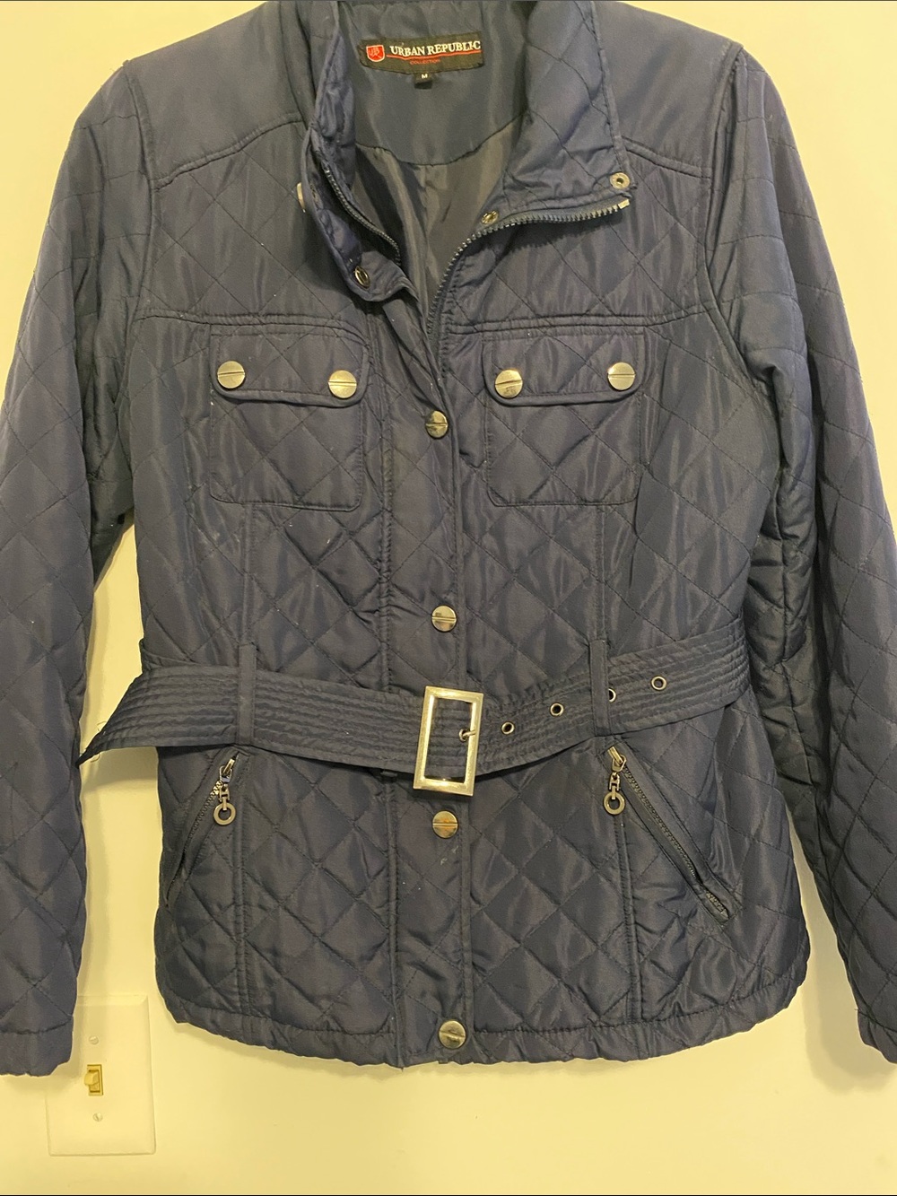 Urban Republic Quilted Navy Utility Jacket with Belt, has a dark mark on sleeve